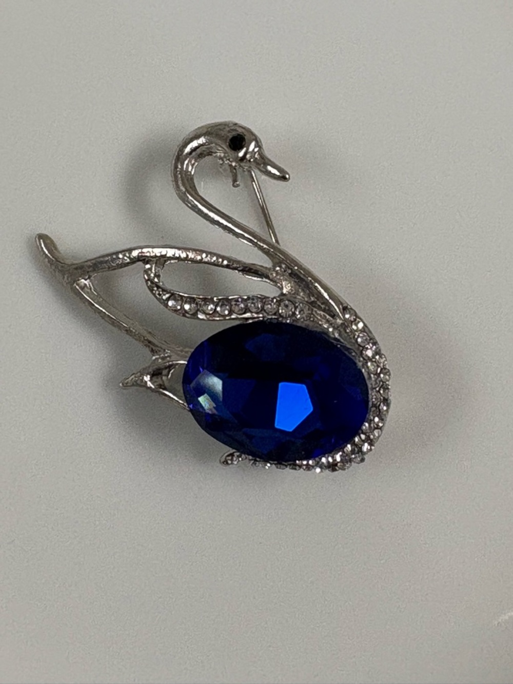 Swan Brooch with Deep Blue Crystal Accent